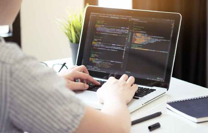 https://www.istockphoto.com/photo/young-programmer-is-coding-and-developing-software-application-in-the-software-gm1177243632-328573080?phrase=code